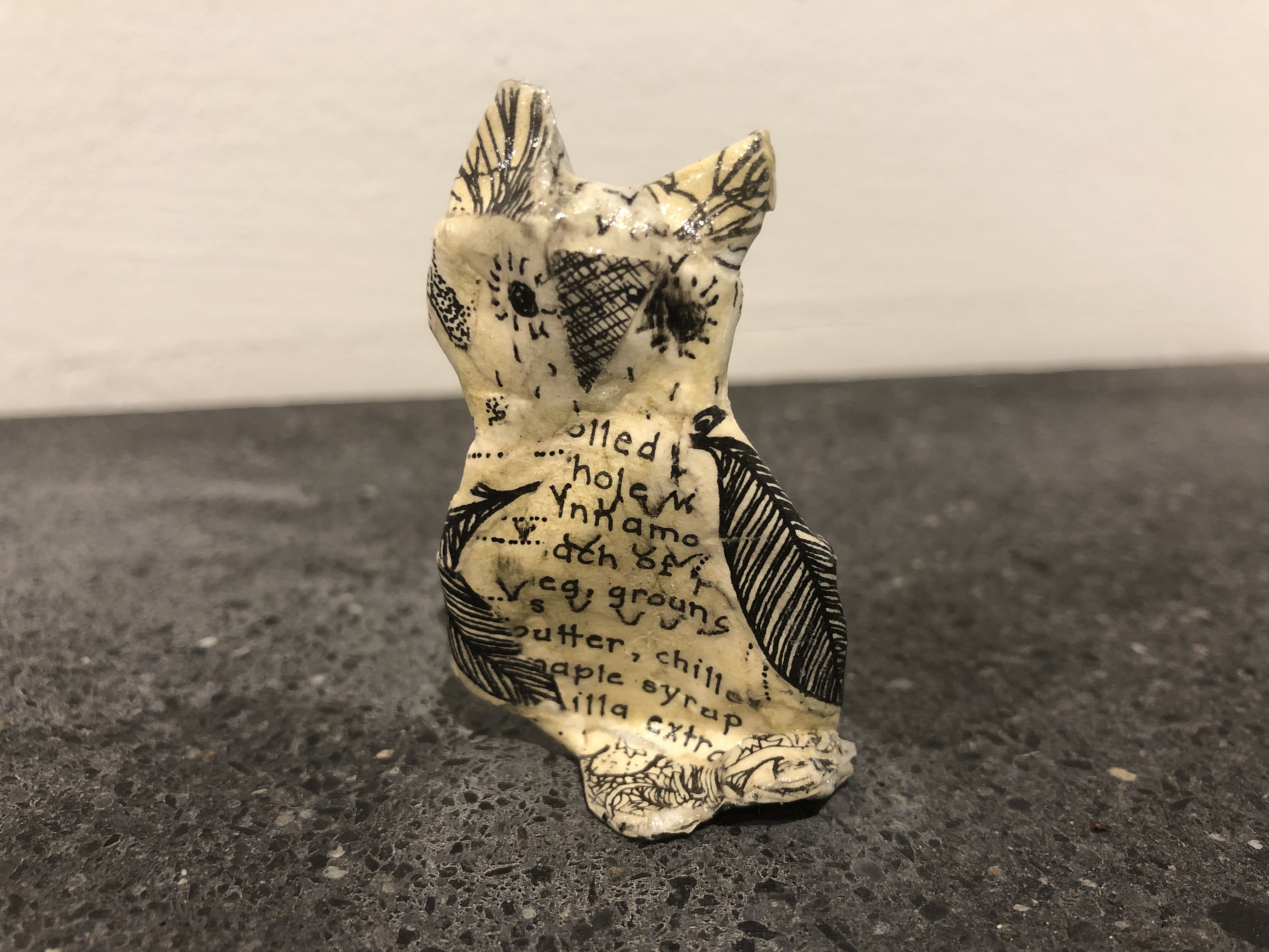 Small paper-mache owl.